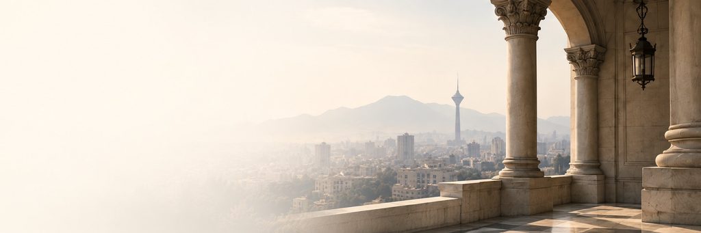 Tehran skyline beneath the mountains, viewed through a stone arcade